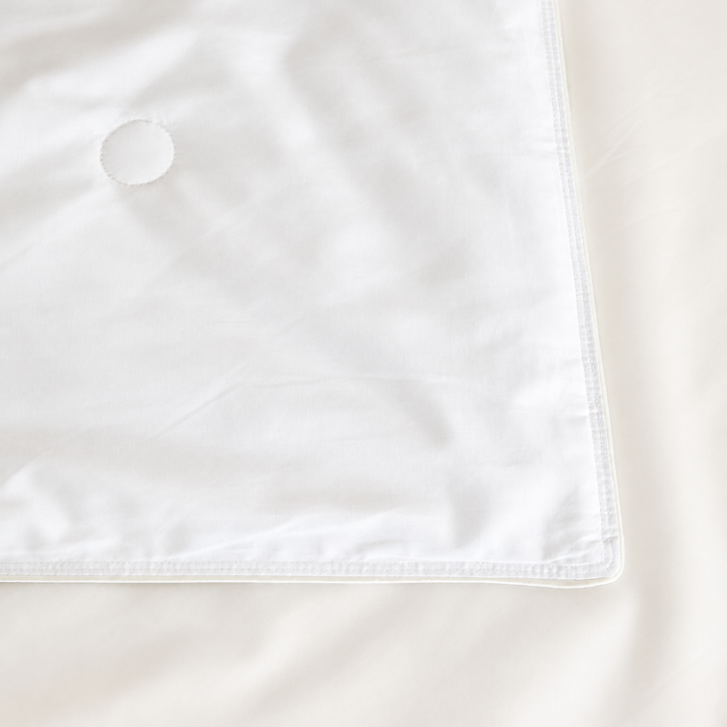 Close-up of the duvet insert’s stitched corner and cotton shell